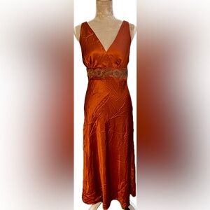 Vibrant Tomato Red Silk V-Neck Gown.